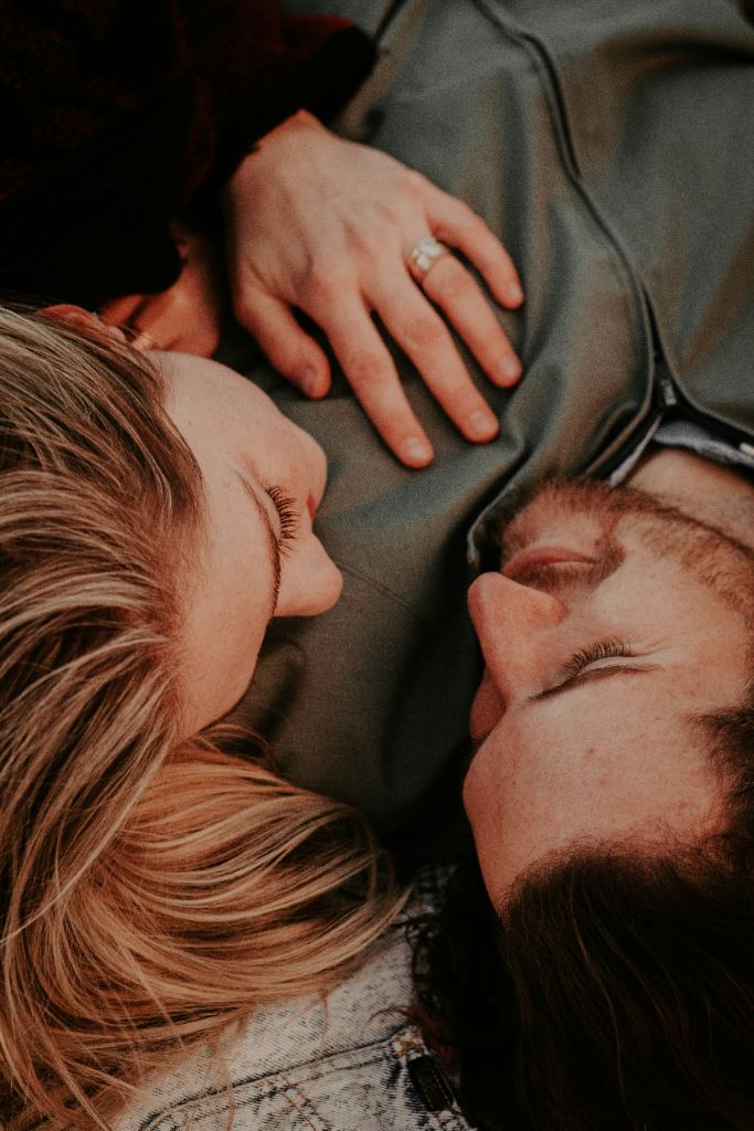Close-up of a couple lying together in a tender moment